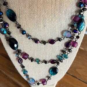 Three strand black chain plastic bead necklace